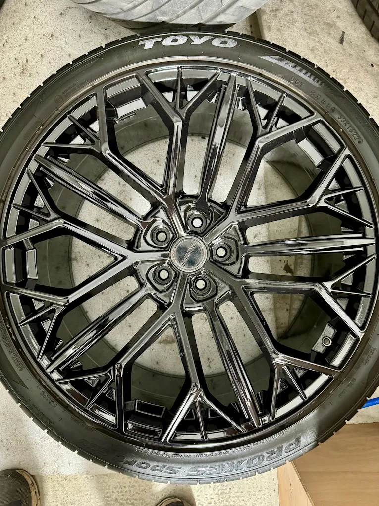 Alloy wheel with a darker metallic custom finish